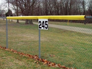 Yellow Baseball Fence Guard on Chain Link Fencing